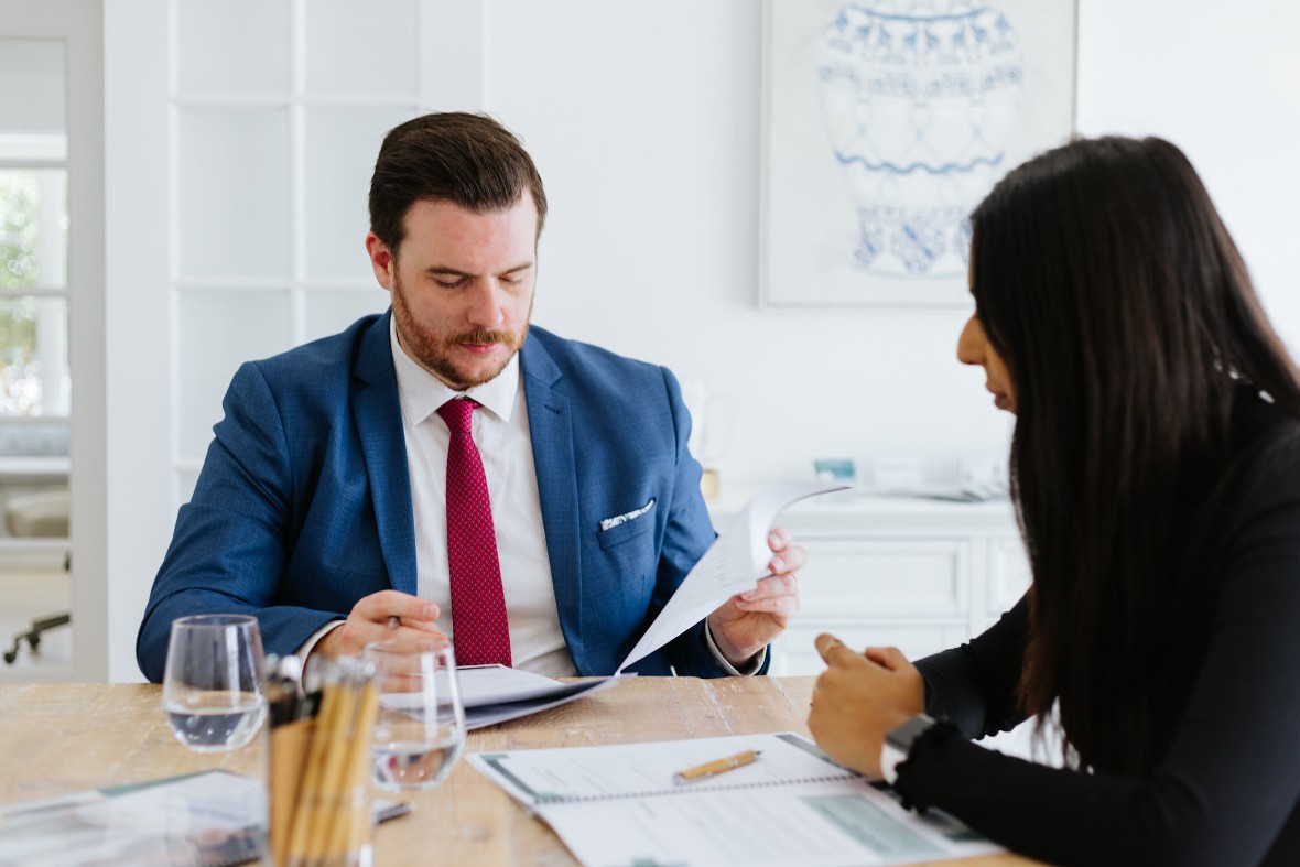 short haired male solicitor reviewing contract 